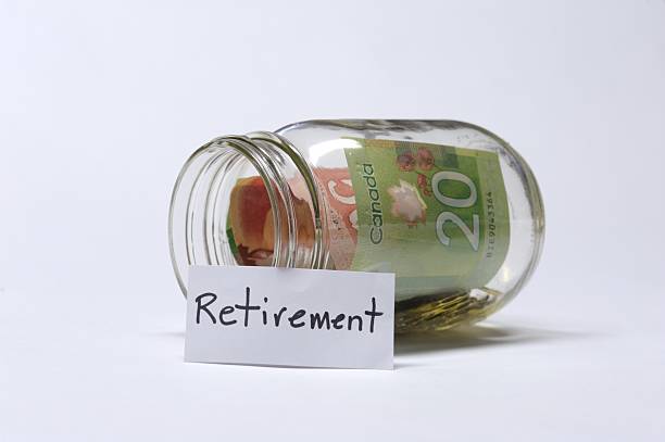 Retirement Savings Jar With Canadian Banknotes