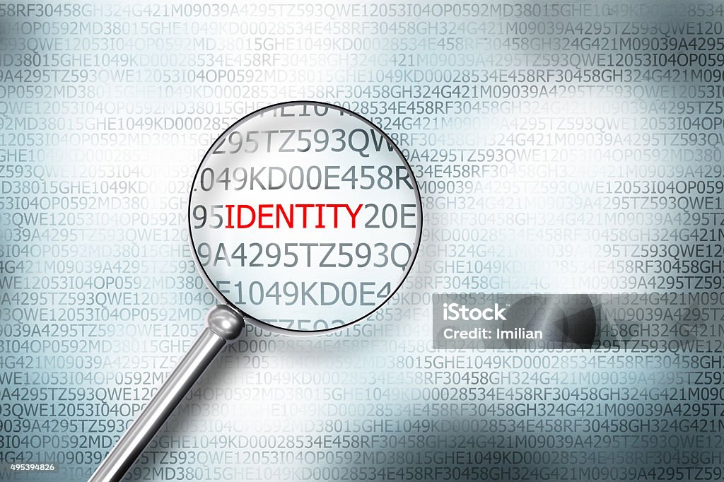 reading the word identity on computer screen magnifying g reading the word identity on computer screen with a magnifying glass internet security Identity Stock Photo