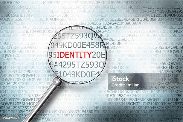 Reading The Word Identity On Computer Screen Magnifying G Stock Photo - Download Image Now
