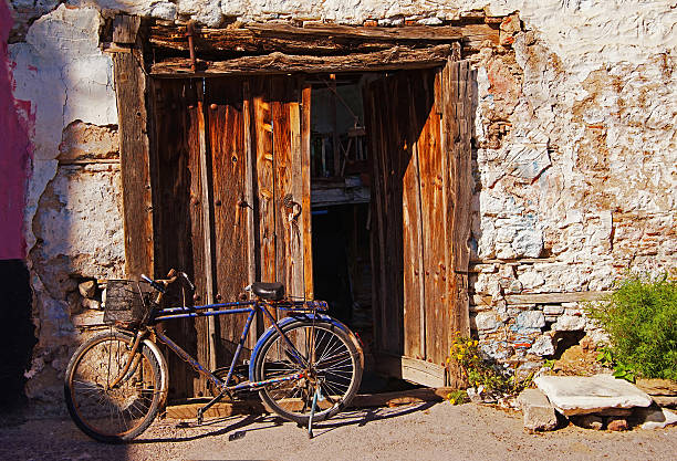 istock Worned Village House And Bicycle 495414668