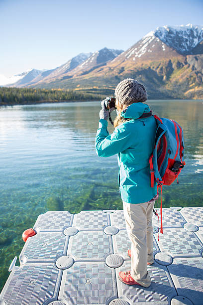 istock Photographer capturing freedom moments in nature 495414702