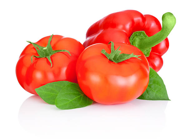 istock Two tomatoes, Sweet Red Peppers and leaves isolated on white 495416043