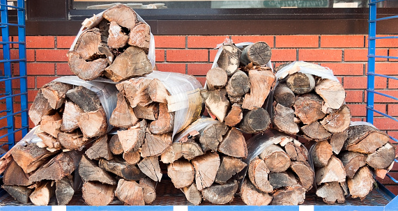 Bundled firewood for sale. Horizontal.