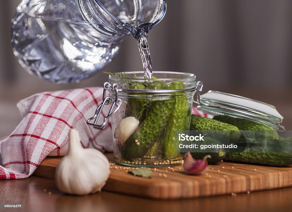 Preparing pickle cucumbers in the kitchen Canned Food Stock Photo
