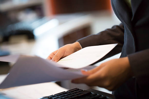 istock Woman holding report in the office 495417290