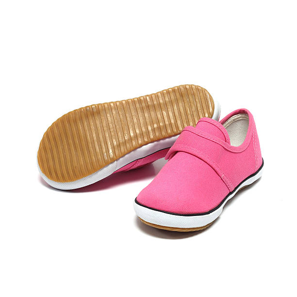 istock Pink baby shoes 495417569