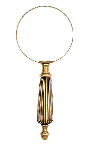 Antique magnifying glass isolated on white