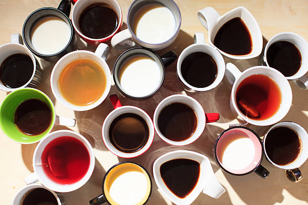 istock tea, coffee and milk in cups from above 495418464