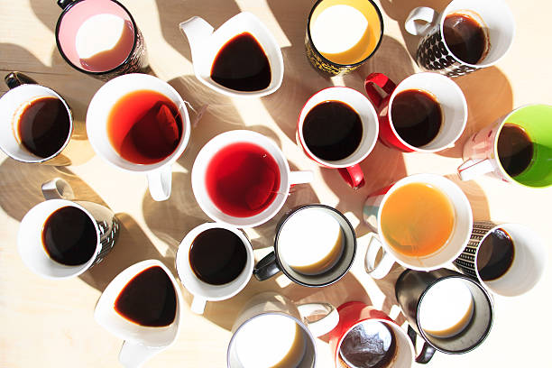 istock tea, coffee and milk in cups from above 495418570