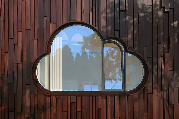 Photo of Evening facade of a modern building with window like a cloud