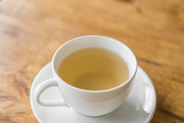 istock Coffee in white cup on wood table 495419350