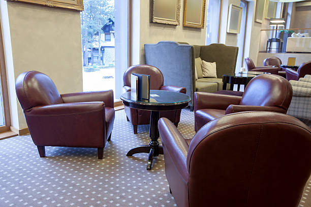istock Leather armchairs in hotel lobby 495419579