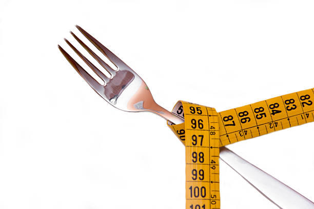 istock Fork with tape measure seen up close 495420586