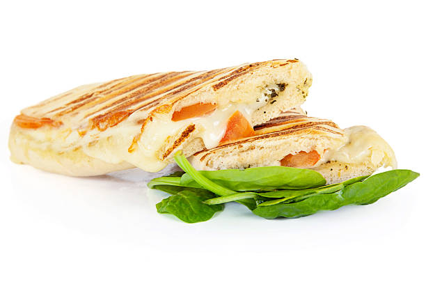 Sandwiches Delicious melted cheese and tomato panini with pesto sauce toasted sandwich stock pictures, royalty-free photos & images