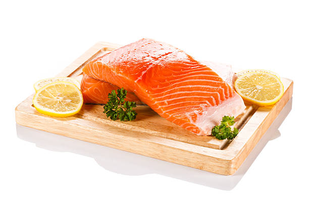 istock Fresh raw salmon fillet on cutting board 495420860