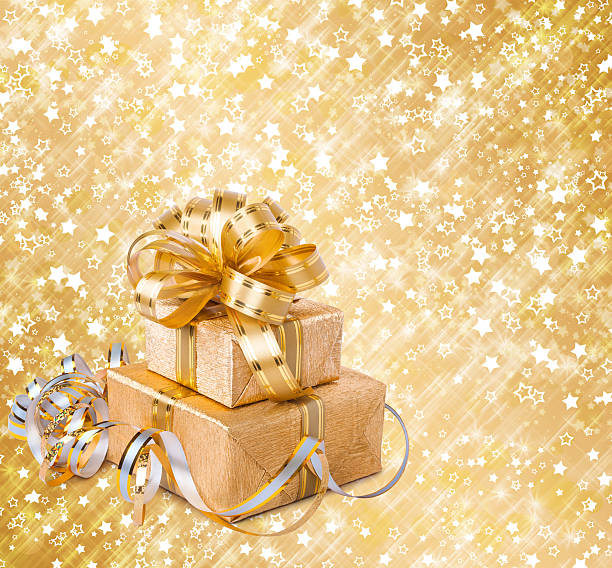 istock Gift box in gold wrapping paper on a beautiful background 495421835