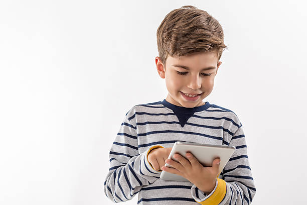 istock Preteen Boy with Digital Tablet on White Background 495436524
