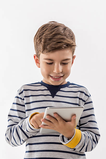 istock Preteen Boy with Digital Tablet on White Background 495436882