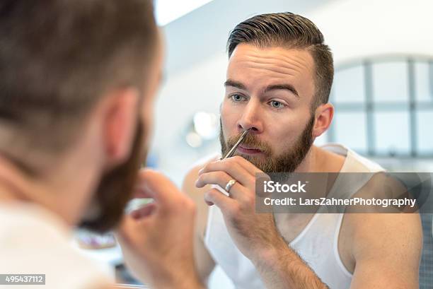 Man Plucking His Nasal Hairs Stock Photo - Download Image Now - Nose, Human Nose, 2015