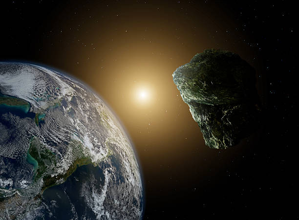istock Asteroid in space near earth in sunlight 495438598