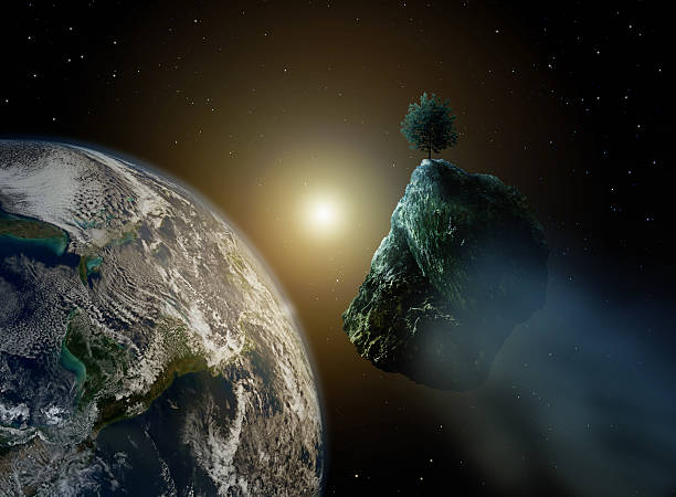 istock new life - asteroid with tree in space and earth 495438658