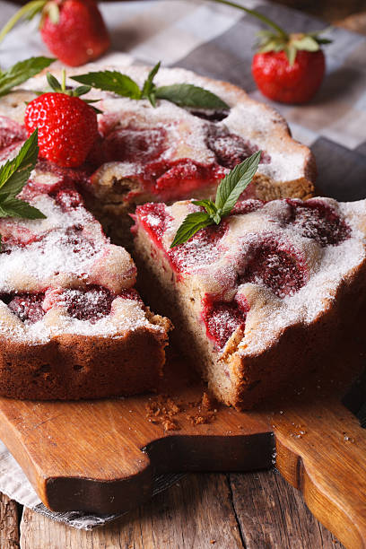 istock strawberry pie with mint on a cutting board macro. Vertical 495439940