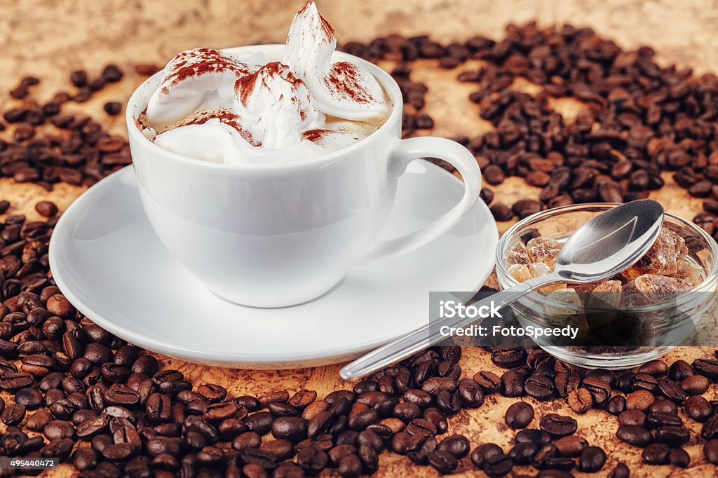 Cup Of Coffee On Wooden Table Cup Of Coffee On Wooden Table With Coffee Beans Around 2015 Stock Photo