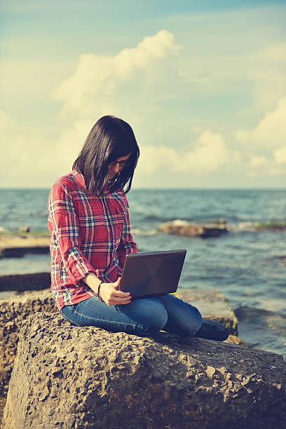 istock hipster girl with laptop 495440806