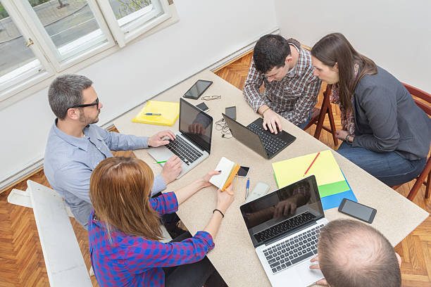 istock Young group of people discussing business plans 495442772