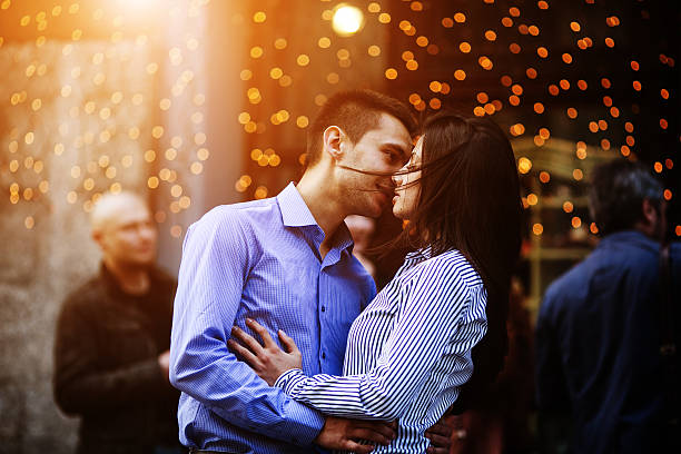 Young adults kissing at a house party in latin america