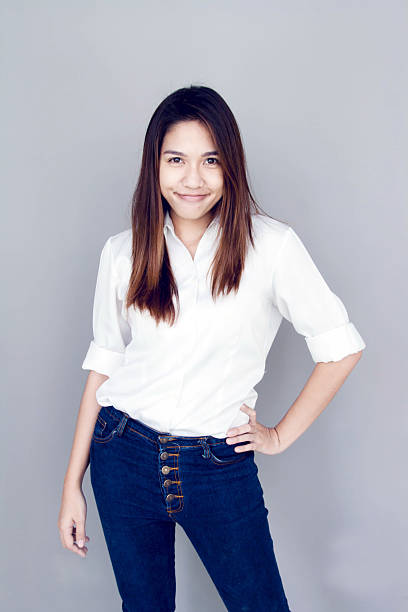 istock asian lady action with white shirt and jeans 495454764