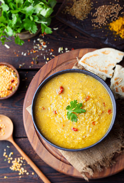 istock Red lentil Indian soup with flat bread. Masoor dal. 495455658