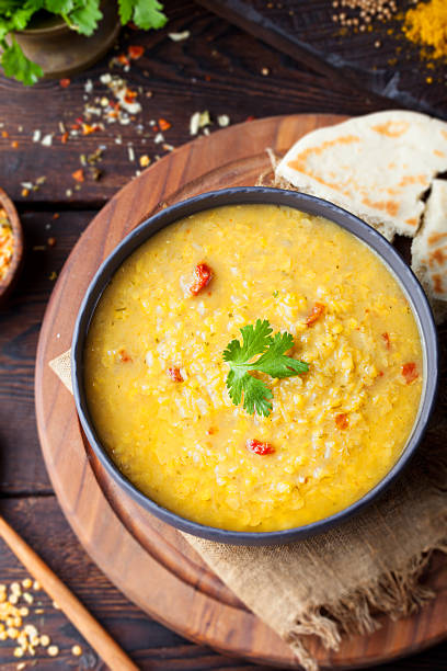istock Red lentil Indian soup with flat bread. Masoor dal. 495455716