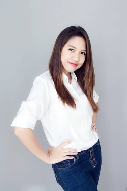 istock asian lady action with white shirt and jeans 495455830