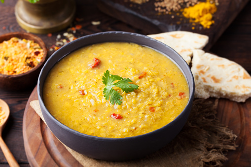 Red lentil Indian soup with flat bread. Masoor dal.