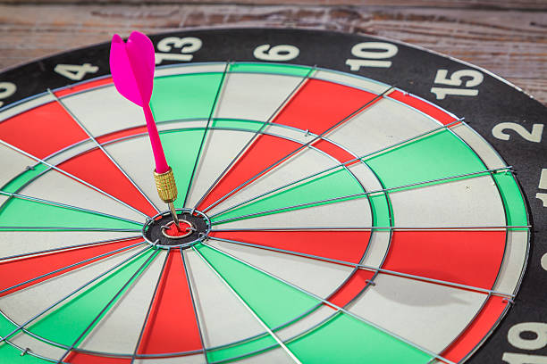 istock Dartboard on wood wall 495456634