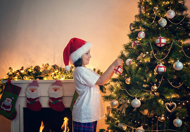 istock Little Girl Decorating Christmas tree 495457612
