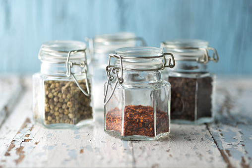 glass jars with colorful pepper