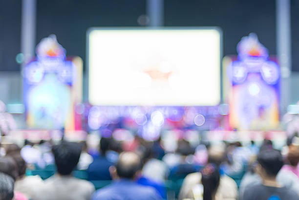 istock blurred image audience in front of stage 495459724