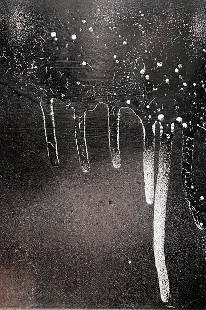 istock Rust-covered fence  with dripping black and white paint 15 495466766