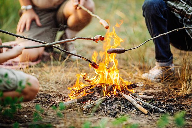 istock Roast sausages over a fire in forest 495466898