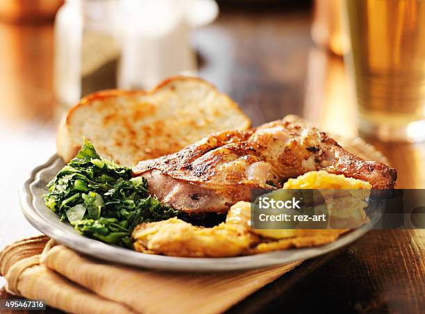 Soul Food Collard Greens Smoked Chicken And Fried Green Tomatoes Stock Photo - Download Image Now