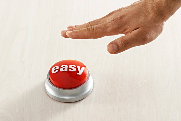 Man Reaching Easy Button Man reaching red easy button. easy button image stock pictures, royalty-free photos & images