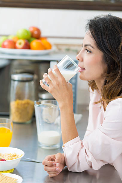 istock Attractive young woman drinking milk 495468518