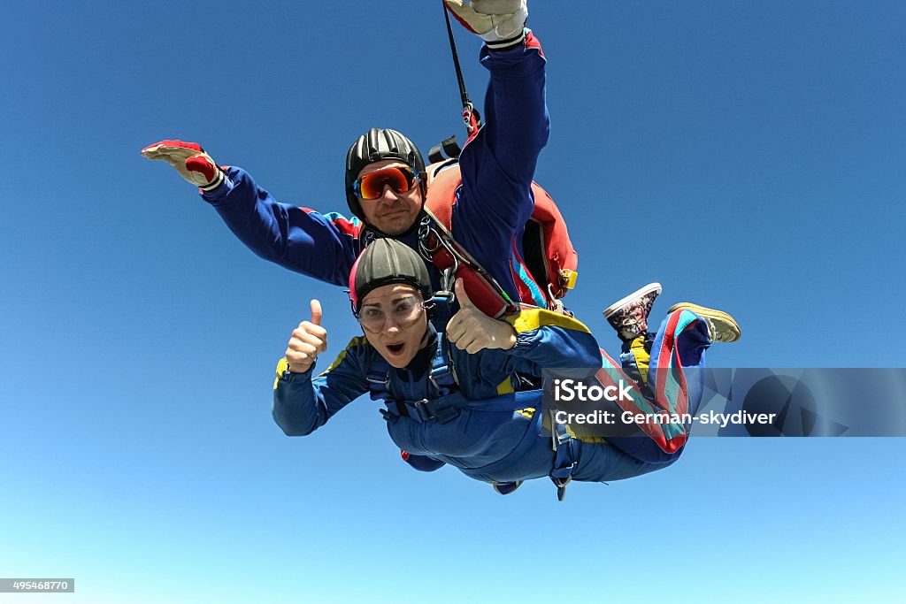Skydiving photo. Tandem. Tandem jump. Flying in a free fall. Skydiving Stock Photo