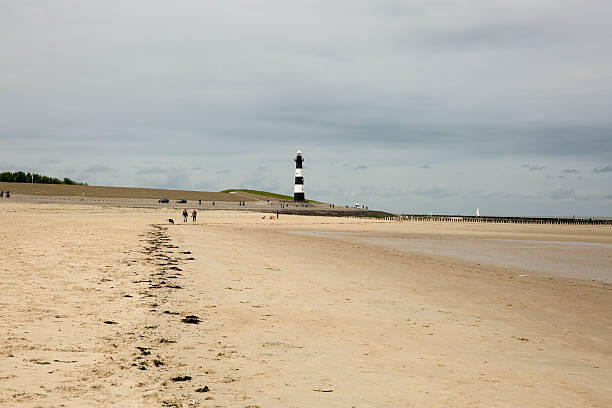 istock Black and white striped lighthouse, Breskens, The Netherlands 495468956