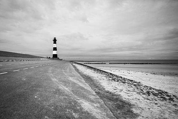 istock Black and white striped lighthouse, Breskens, The Netherlands 495469104