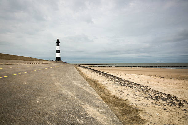 istock Black and white striped lighthouse, Breskens, The Netherlands 495469120