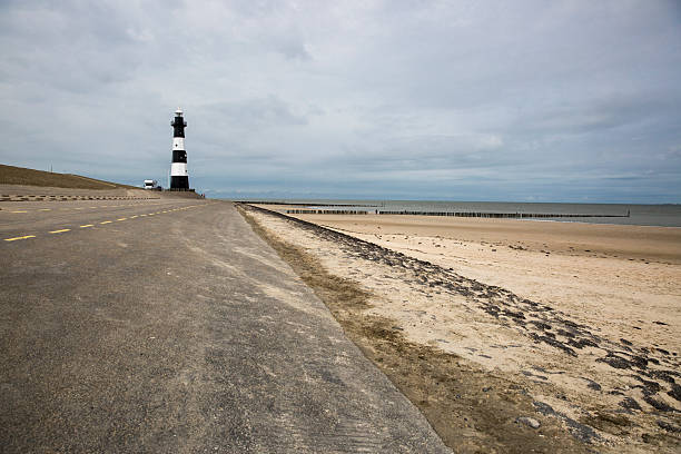 istock Black and white striped lighthouse, Breskens, The Netherlands 495469154