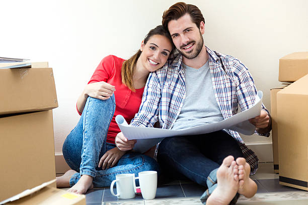 istock Young couple moving in new home 495469623